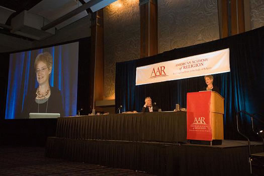 AAR President Ann Taves introduces Plenary Speaker Frans De Waal.